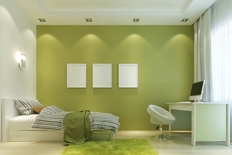 Olive shade green bedroom paired with white brings minimalist look