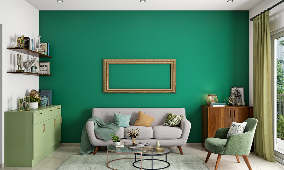 Emerald green living room wall with a green sideboard