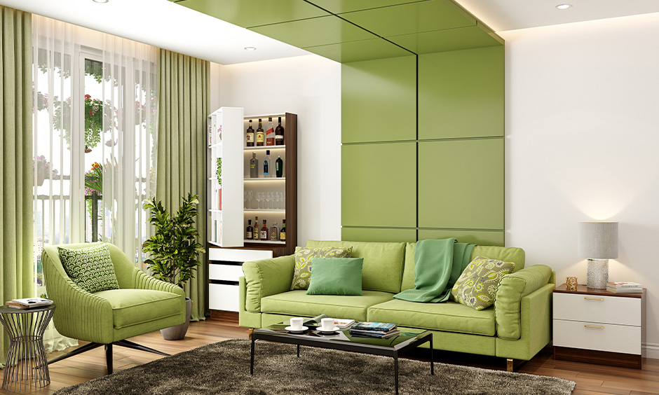 A floor-to-ceiling green wall panelling in living room design