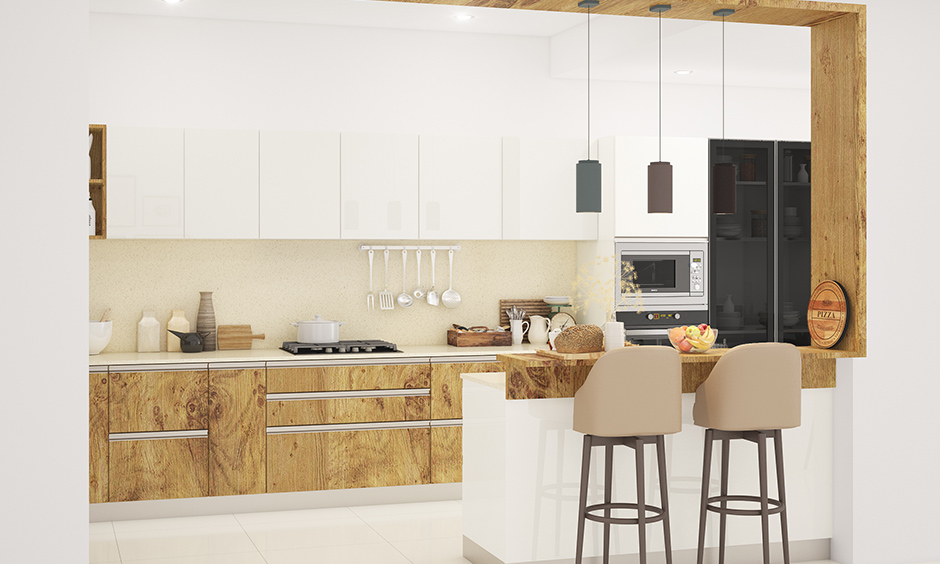 Open white kitchen with wooden wardrobe designs for kitchen makes space interactive in nature.