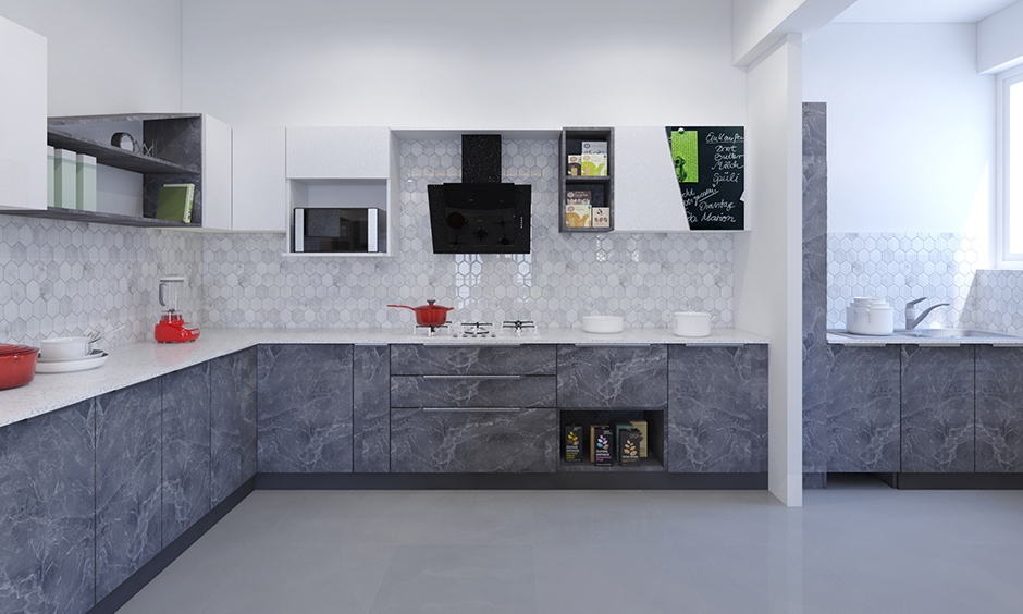 Open kitchen wardrobe design with a classy marble finish laminate keeps this kitchen breathing full and free.