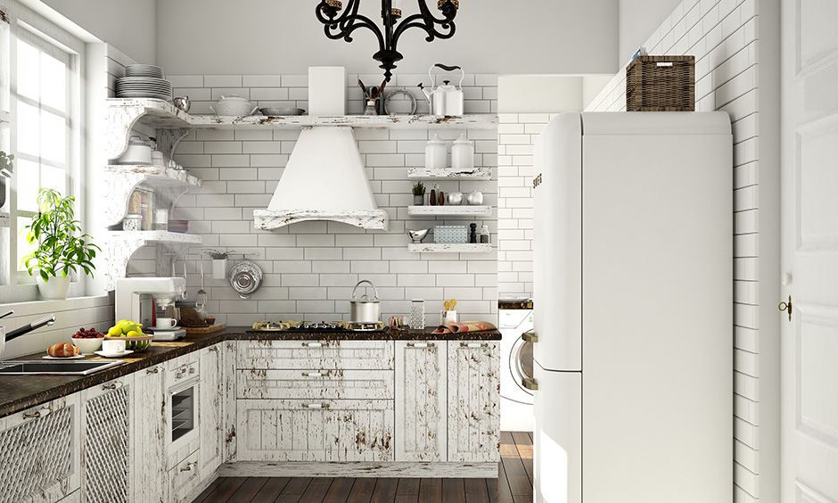 White small kitchen wardrobe designs with rustic wooden finish, unique shelf design and wooden flooring look soothing.