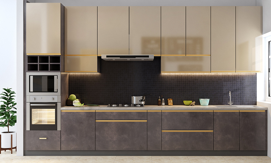 Industrial single wall kitchen design with the sparkle of gold-finished cabinets and gold railings looks luxury