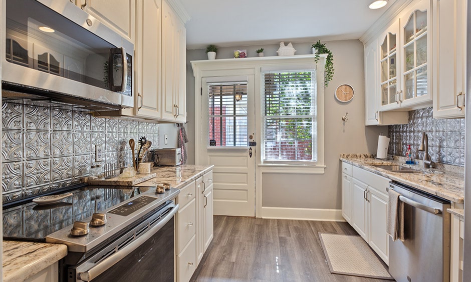 Galley kitchen layout with a whitewood kitchen with a hint of english touch