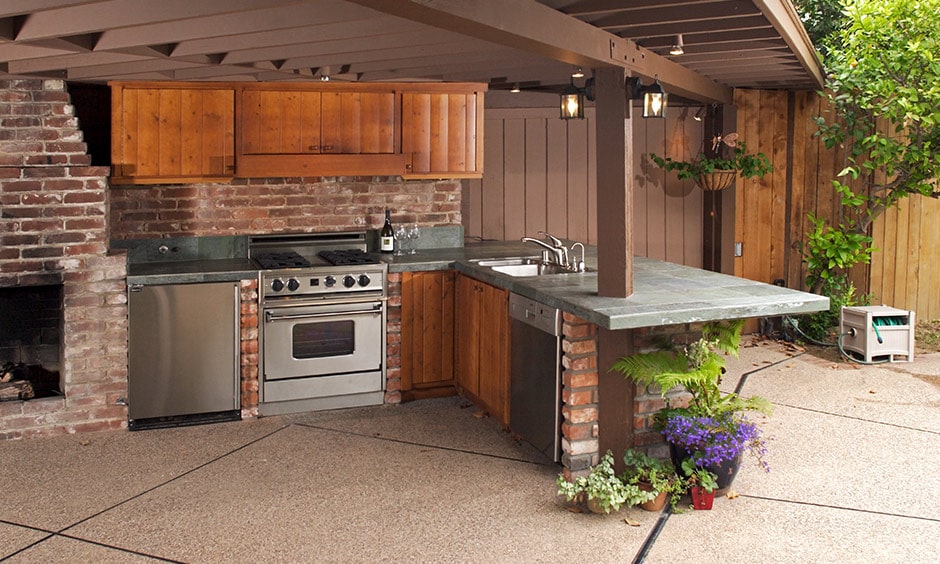 Outdoor kitchen idea with an outdoor brick kitchen with a pool makes a summer’s day