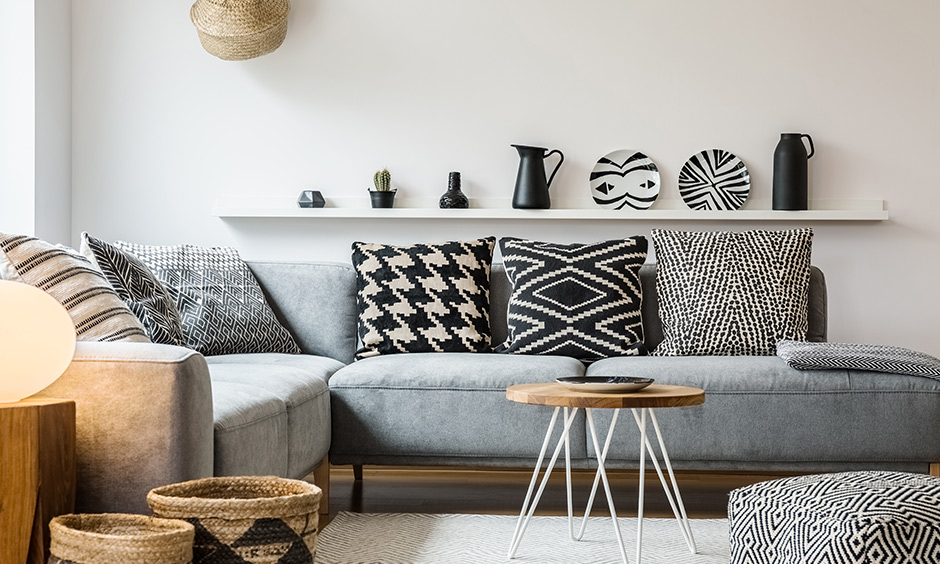 Sofa upholstery ottoman in a jazzy print with matching cushions gives this living room a bit of character.