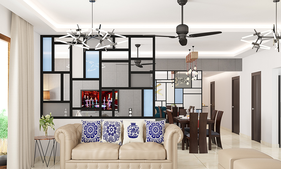 Ceiling hanging lights for the living room along with cove lighting provide a mix of both, soft lighting and style.