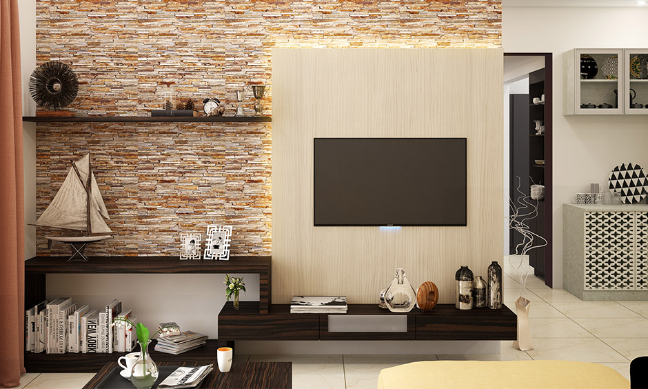 Accent wall ideas for small living room: Exposed brick wall is a perfect backdrop for the TV unit & floating shelves