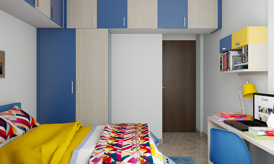 Bedroom wardrobe colours designed in half blue and the half beige combination works well.
