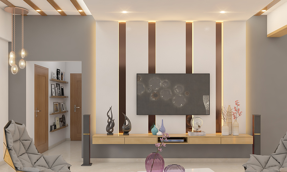 Ceiling lights design for living room embedded in the wooden panels bring in a beautiful dimension to space.
