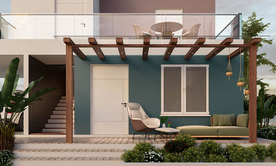 Modern farmhouse entry exterior designed with pergola, couch, and an armchair with a footrest is stunning.