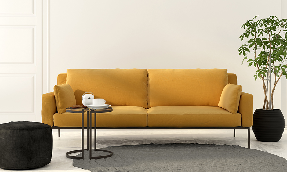 Mustard yellow chair and sofas that works well with light colour walls