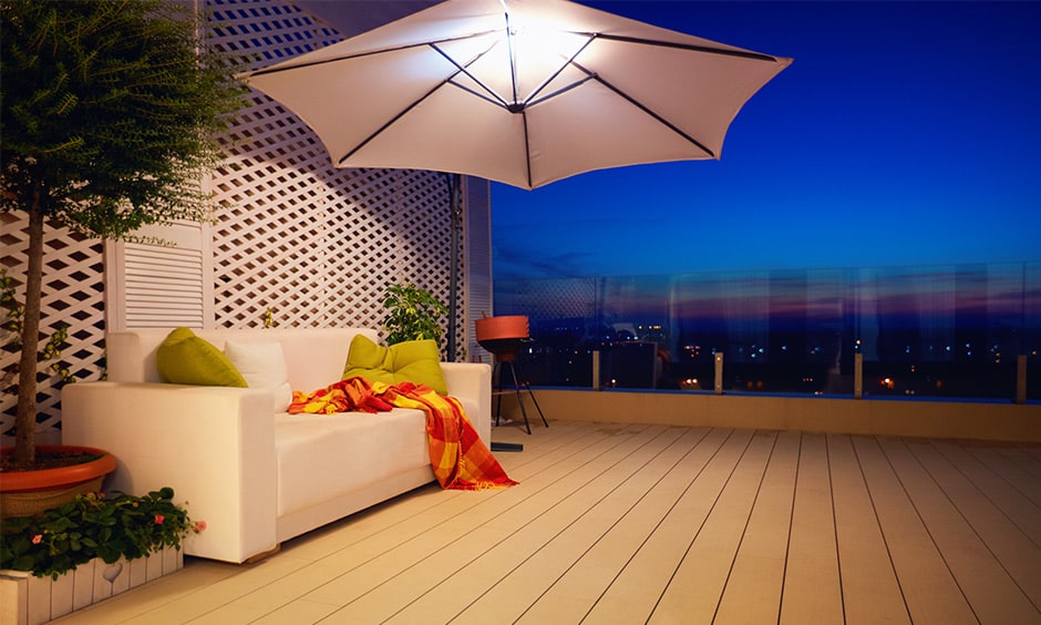 Simple DIY decor hack with umbrella and seating arrangement in a balcony