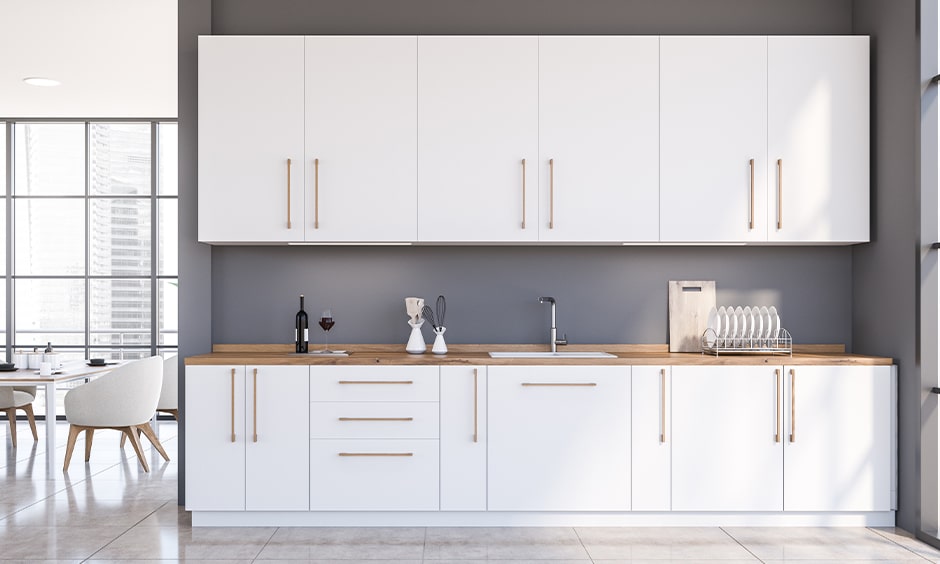 White laminate cupboards for straight kitchen