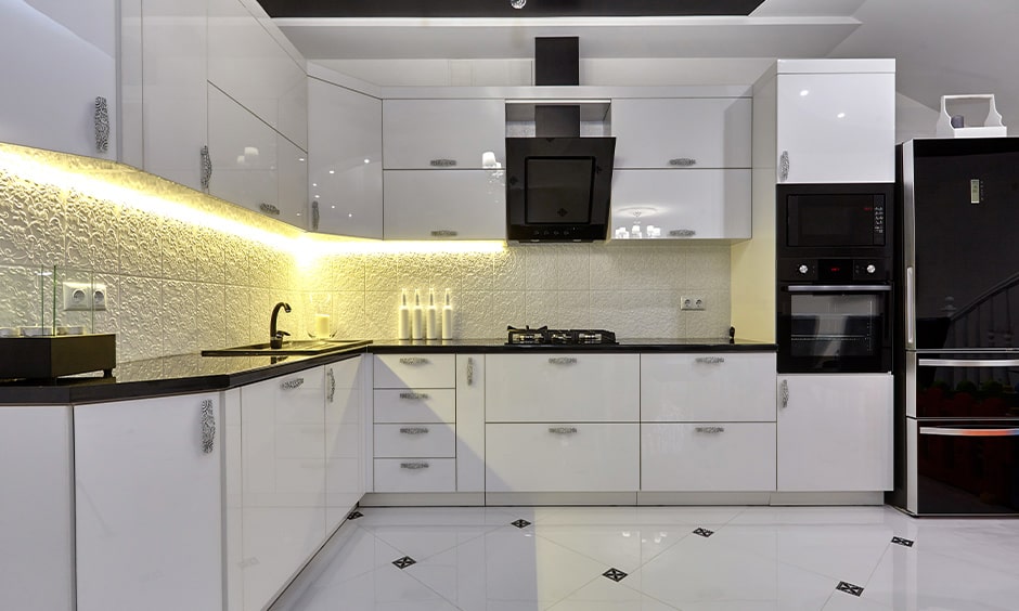 White modern cupboards in l-shaped ktichen
