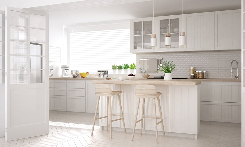 White wooden kitchen cupboards with traditional touch