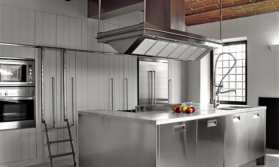 Metal kitchen profile shutter in this island white kitchen looks airy and more spacious.