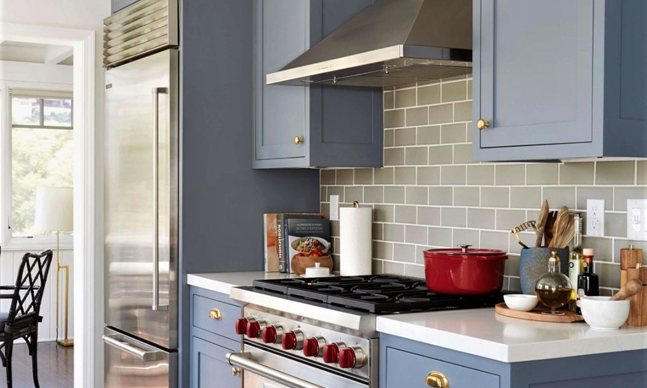 Grey coloured cabinets in this kitchen profile shutter design in swing very convenient to use and durable.