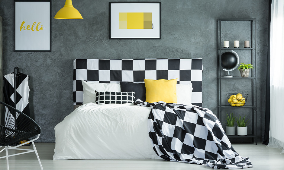 Charming checkers black and white bedroom design designed with a dark wall and a bed