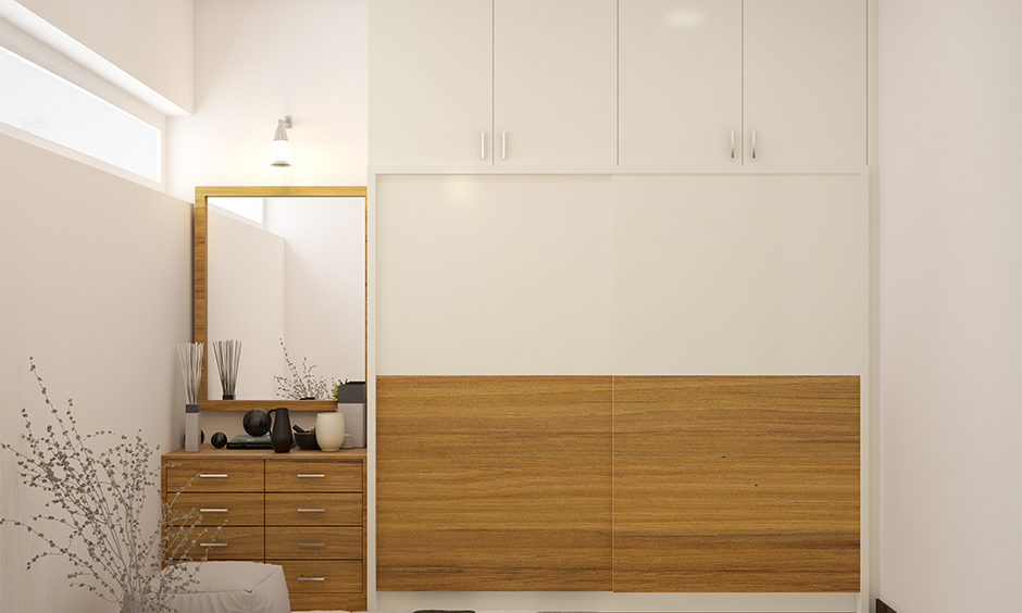 Dressing unit with mirror and drawers in the small bedroom attached to the wardrobe