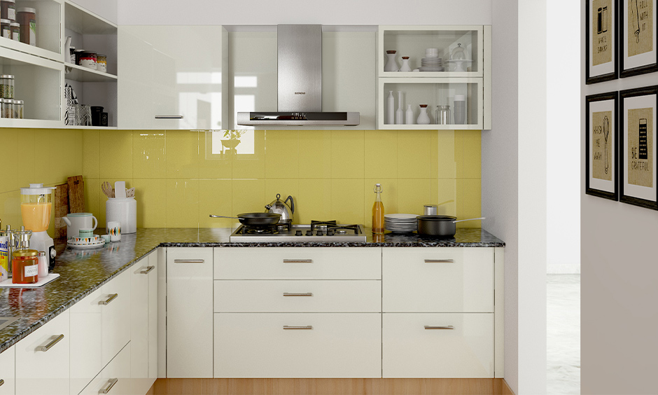 L-shaped yellow and white kitchen, White cabinets and backsplash in yellow colour in minimal design look delightful.