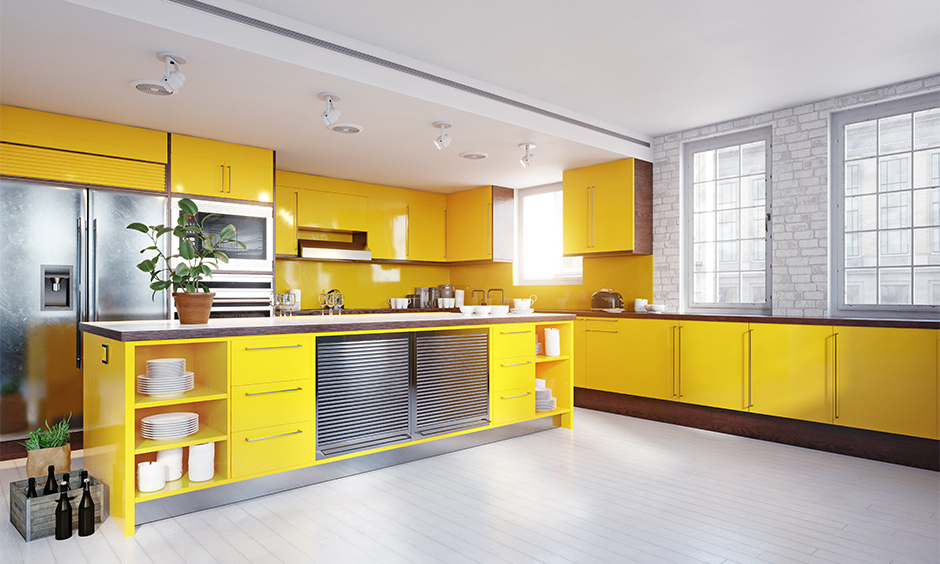 Yellow kitchen island combined with grey and white colour look aesthetic.