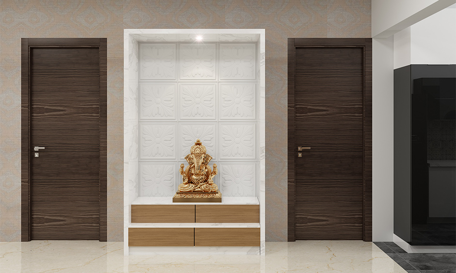 Pooja room with simple wooden cupboard design and clean look is the cupboard design for pooja room.