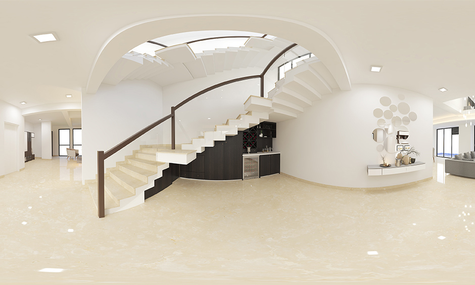 Marble contemporary staircase in white colour with wooden railing design adds dollops of elegance.