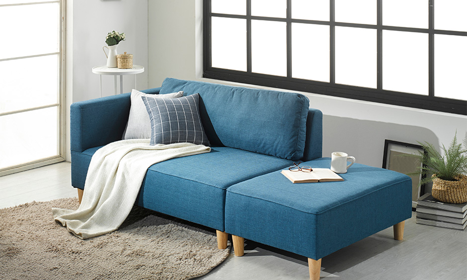 Small space-saving sofa bed in blue colour