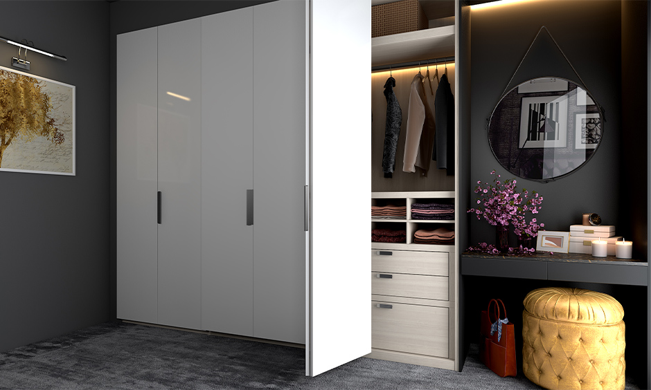 A Bi-fold space-saving wardrobe with a dressing unit that gives luxurious look to the room
