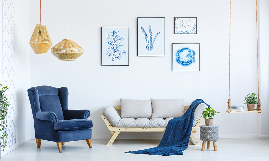 White living room with a blue accent armchair is best modern home decor idea