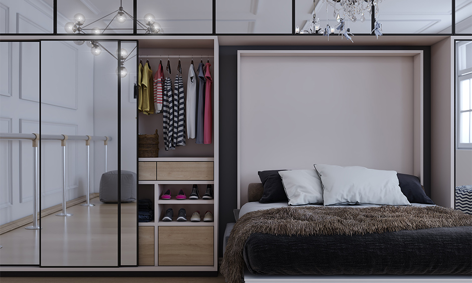 A multifunctional space-saving wardrobe with a Murphy bed creates the perfect space-saving wardrobe idea.