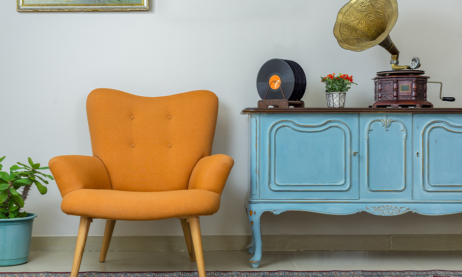 A living room with vintage furniture and a chair is a modern home decor item