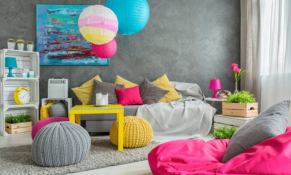 Home decor idea with bohemian elements like cushions, vases and bright chairs brings an vibrant look.