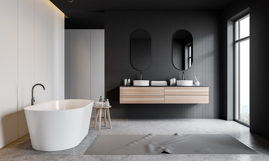 Industrial chic bathroom with oval mirrors and sinks