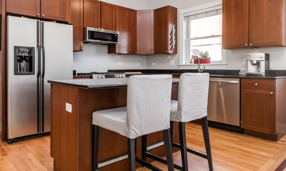 Modern small kitchen design with an island and two chairs are the perfect addition to the kitchen area