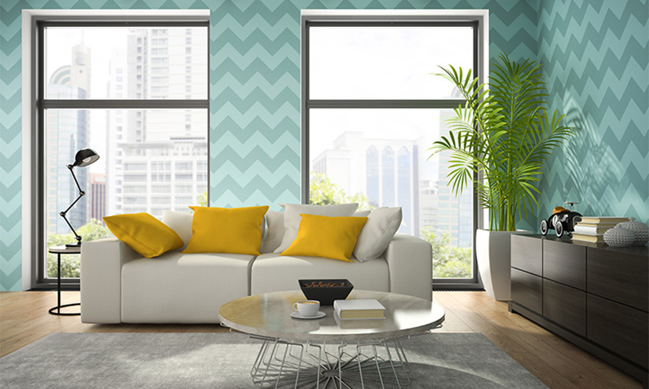Navy blue and yellow decor idea for living room with light blue wallpaper