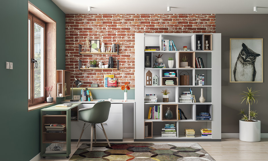 Modern industrial home office with partially exposed brick wall