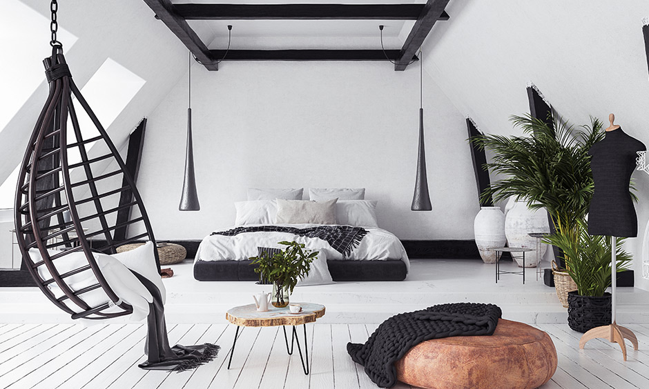 A black wooden false ceiling design for bedroom with sleek pendant lights on either side of the bed