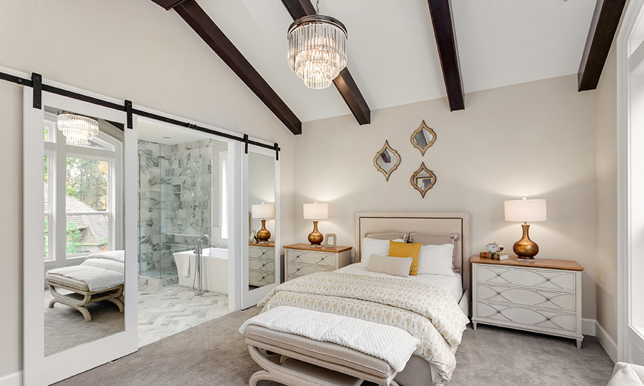 A minimalist modern wooden false ceiling design for bedroom with a darker shade