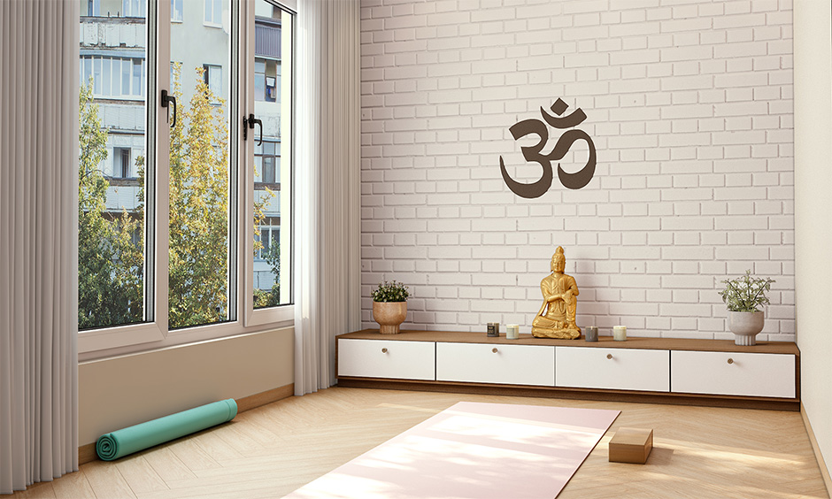 A yoga room decorated with house plants and light tea candles set a calm mood and boost positive energies