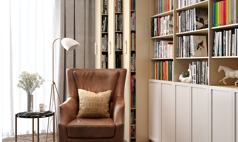 A modern book almirah with sheer and dark curtains in reading room