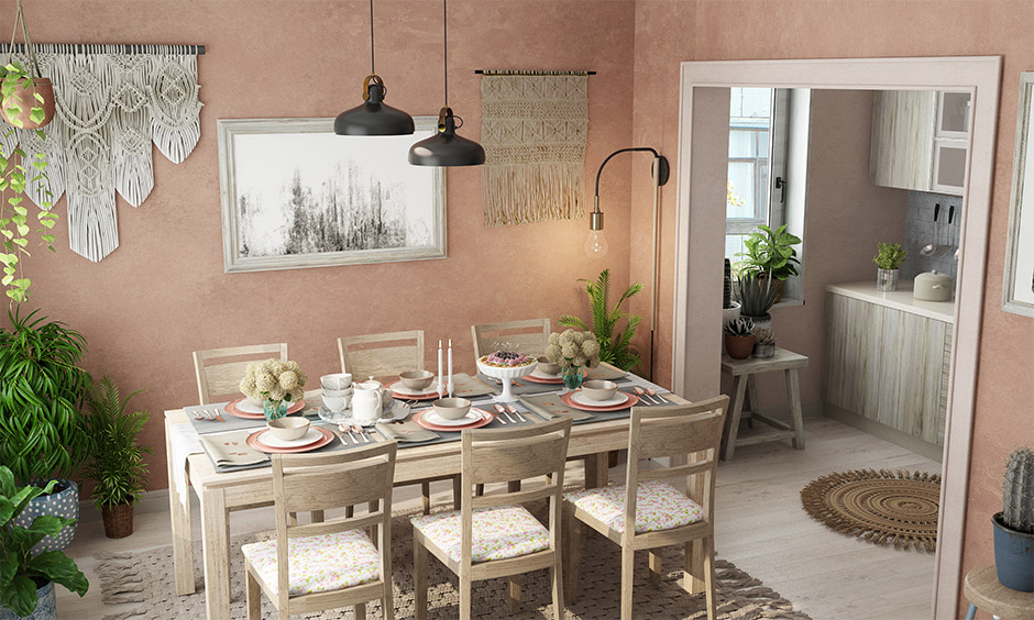 The dining room in wabi-sabi style interiors with a wooden dining table and earthy colour scheme brings in a calming vibe