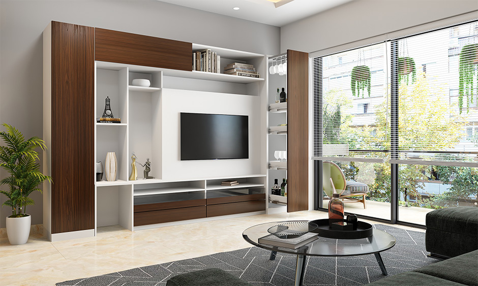 Pull-out hidden bar cabinet design for living room integrates well with the room's decor