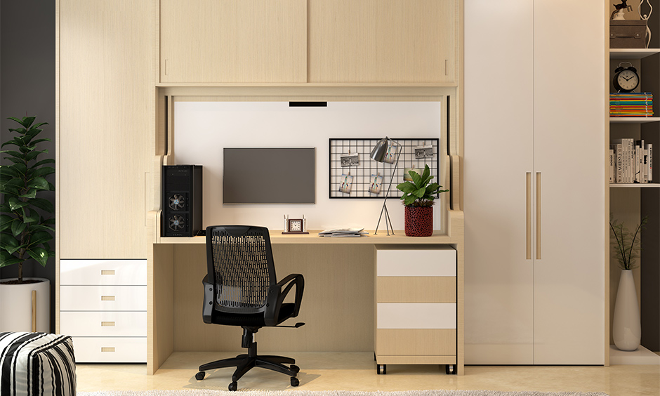 Carve out a corner wardrobe with study table which is perfect for those who live in small spaces