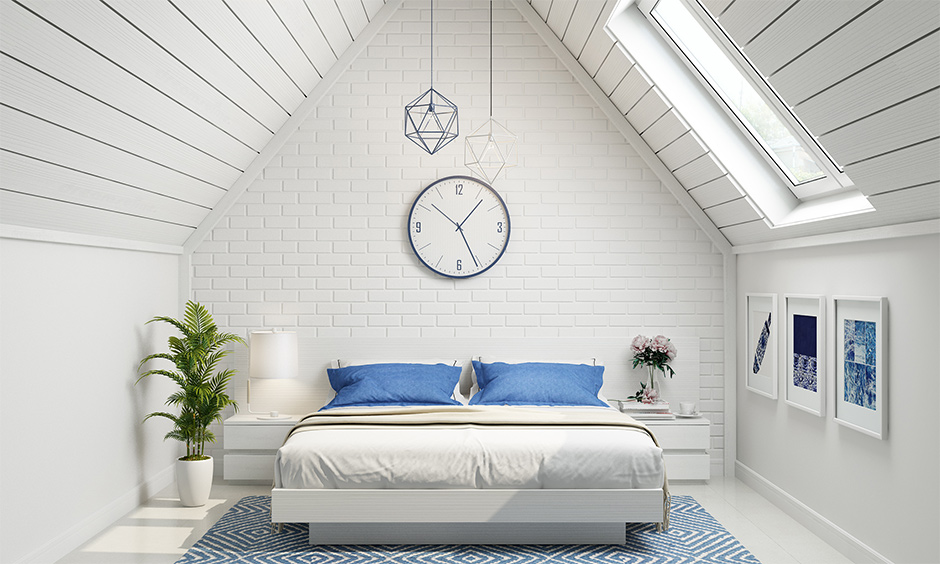 A bedroom floor carpet design in a geometrical pattern complements the sloping architecture of the attic bedroom