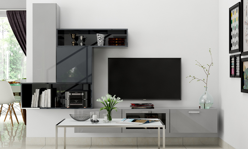 Wall-mounted l-shaped tv cabinet design with a vertical shelf elevates the living room