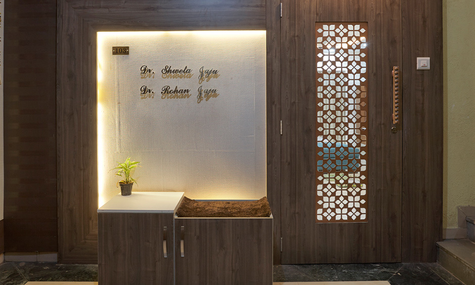 Wooden jali design for main door gives traditional Indian touch