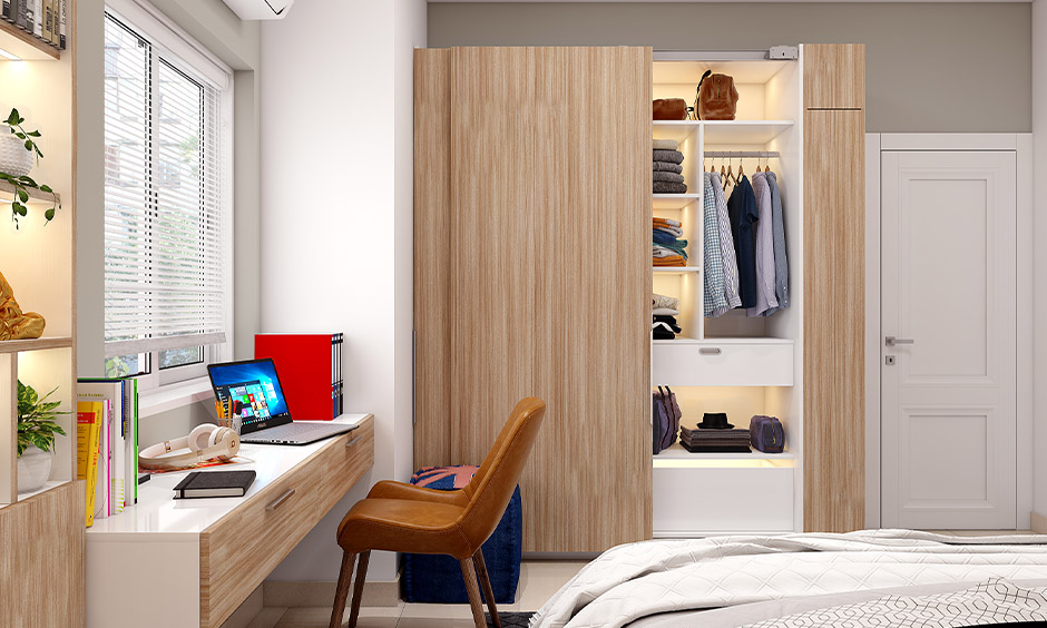 Wooden wall-fixed almirah with sliding door provides a stylish storage solution
