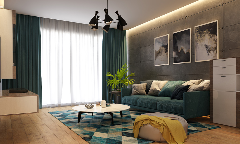 Living room features a concrete wall interior design adorned with wall art and LED backlights